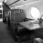 Private jet cabin with workspace and high-speed inflight connectivity