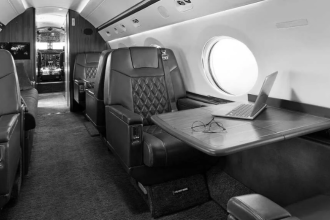Private jet cabin with workspace and high-speed inflight connectivity