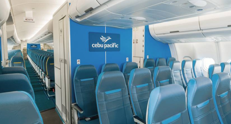 Cebu Pacific aircraft cabin with modern seating and interior branding.