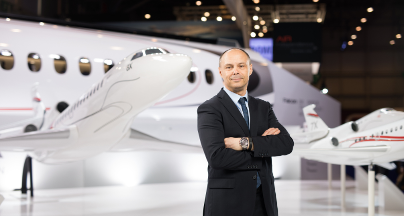 Dassault Aviation executive standing beside a Falcon 6X