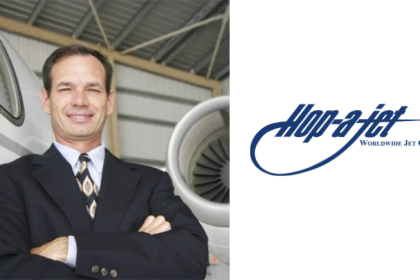 Barry Ellis of Hop-A-Jet standing beside a private jet