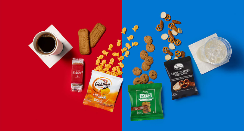 American Airlines Main Cabin snacks including cookies, Goldfish and snack mix