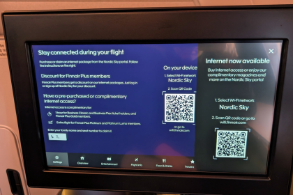Finnair passenger using in-flight Wi-Fi on an Airbus aircraft