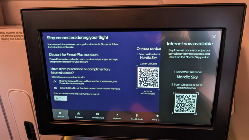 Finnair passenger using in-flight Wi-Fi on an Airbus aircraft