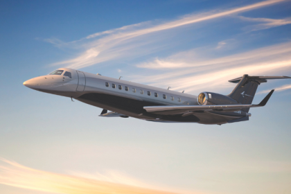 Embraer Legacy 650 business jet flying above clouds