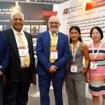 ABC International and JSD Corporation representatives at an aviation industry event.