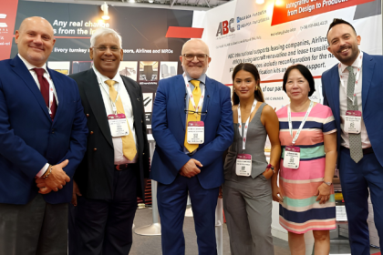 ABC International and JSD Corporation representatives at an aviation industry event.
